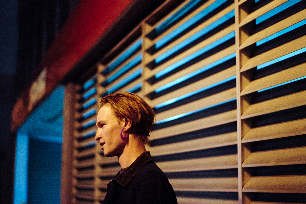 person by window