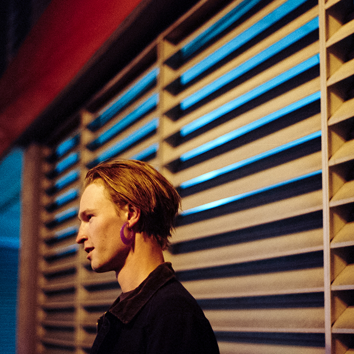 person by window