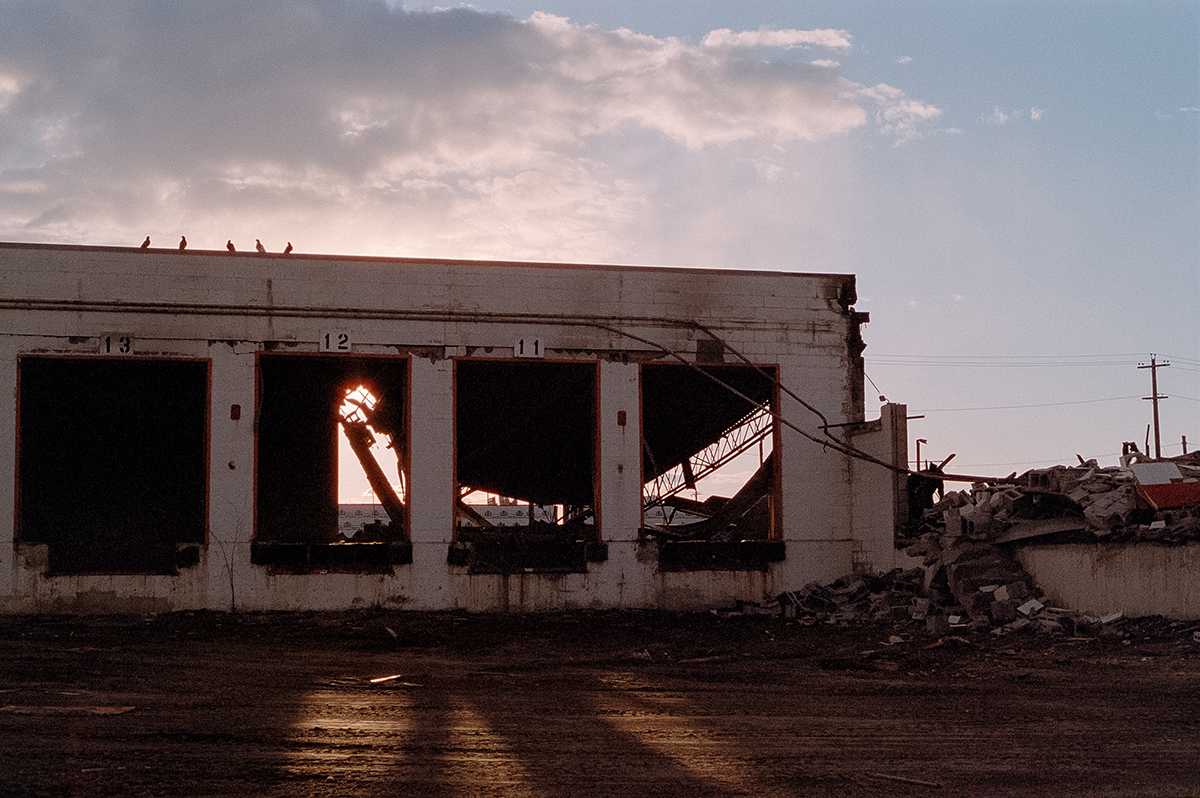 industrial building shell and sunset