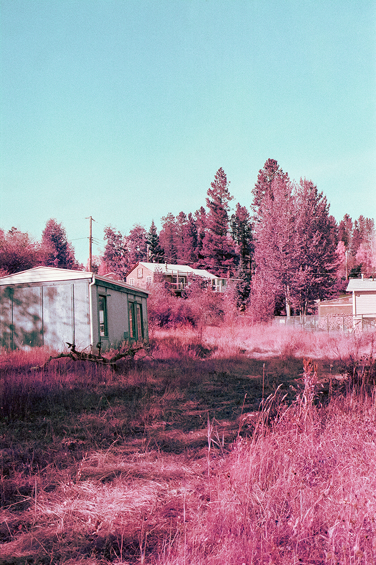 prairie field with two buildings