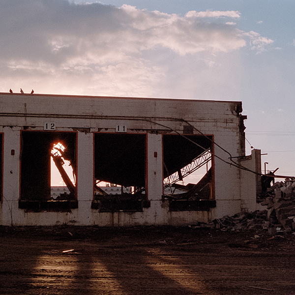 industrial building shell and sunset