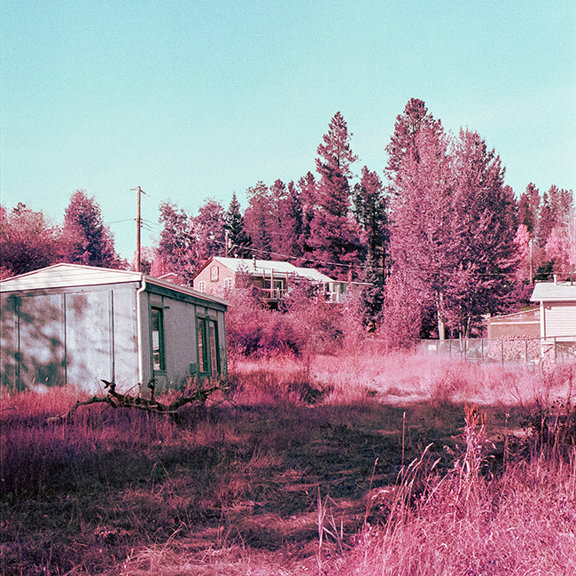 prairie field with two buildings
